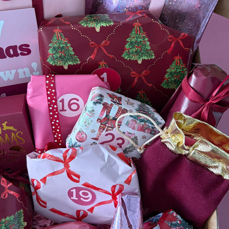 Close-up of beautifully wrapped Christmas Advent gifts and numbered surprises