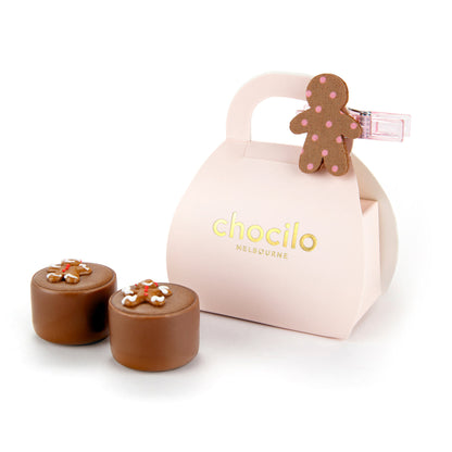 Chocolate truffles with a pink container featuring 'chocilo Melbourne' branding on a white background.