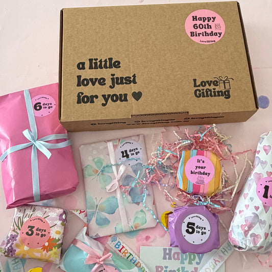 Open 60th Birthday Advent gift box with individually wrapped birthday surprises.