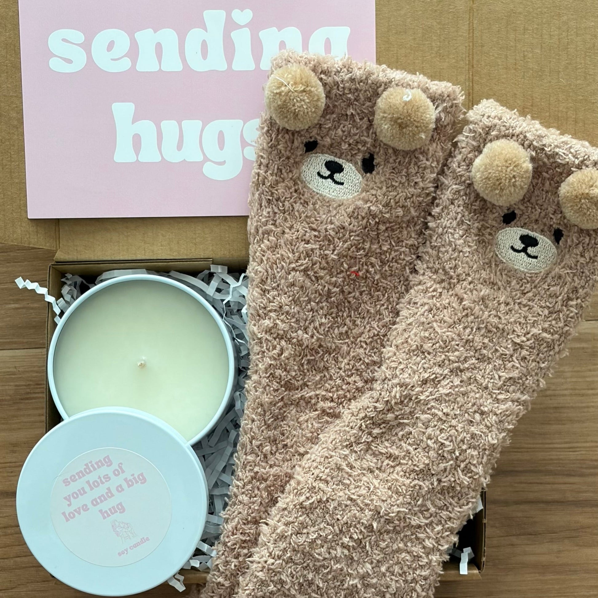 Pair of fluffy brown socks with bear faces and a candle , sending hugs gift box australia