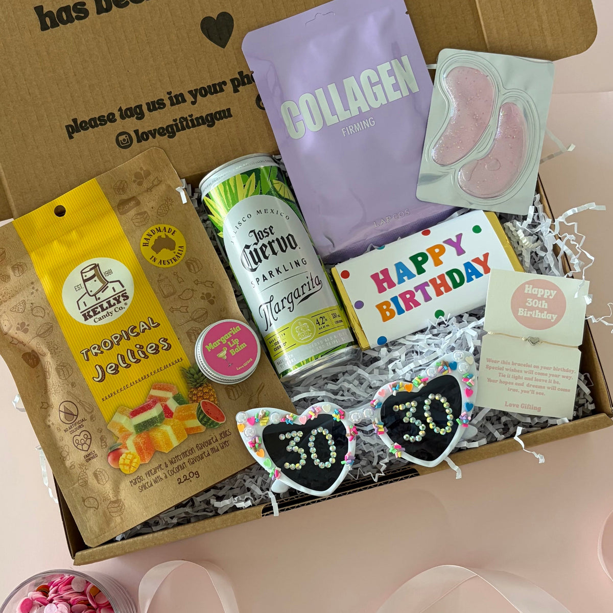 30th gift Box includes cocktail can, tropical lollies. 30th sunglasses, facemask sheet and lipbalm.
