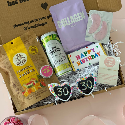 30th gift Box includes cocktail can, tropical lollies. 30th sunglasses, facemask sheet and lipbalm.