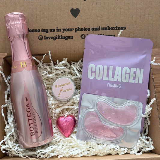 Box with Bottega pink bottle, collagen package, and heart-shaped item on a wooden surface.