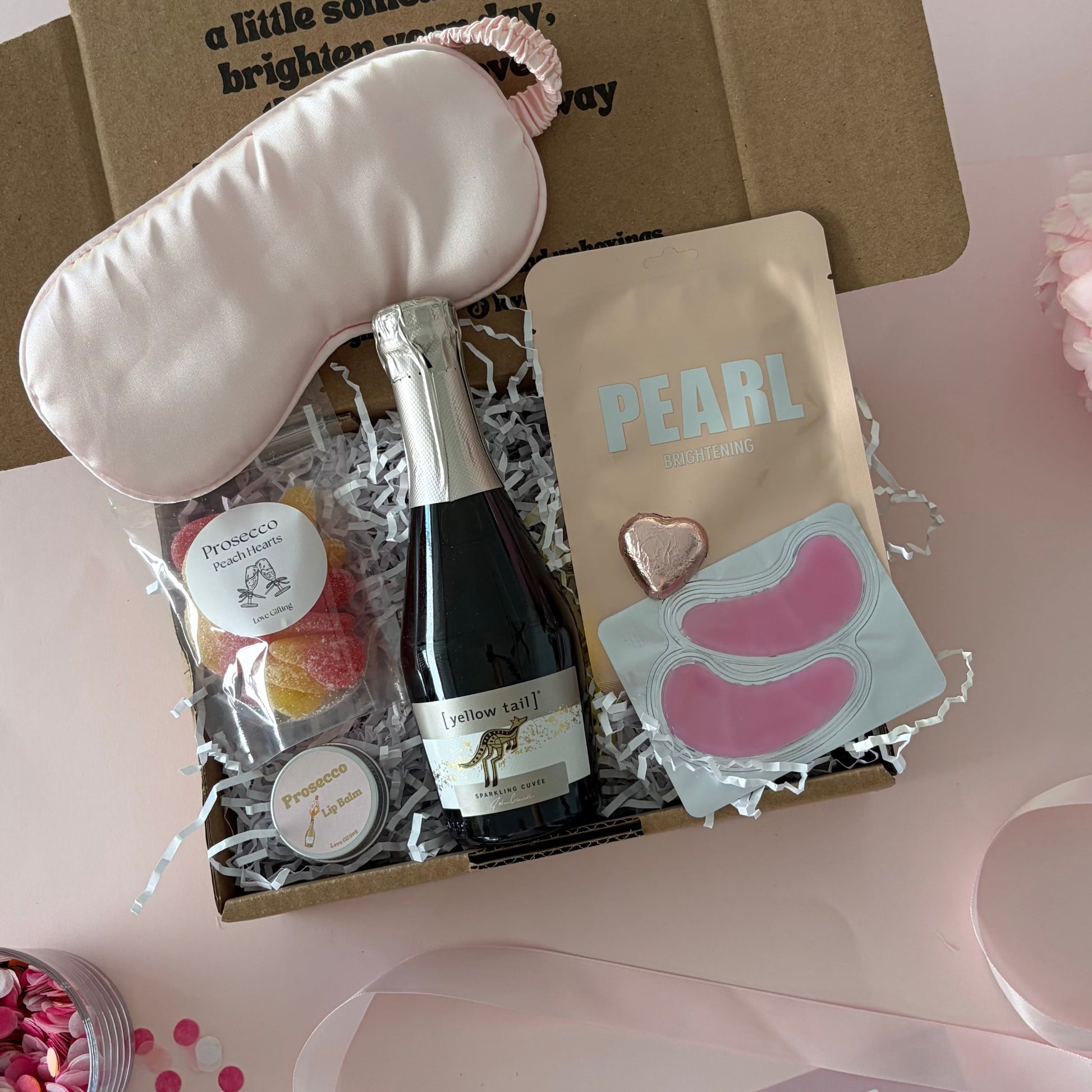 Prosecco gift box includes prosecco, lapcos face mask, sleep mask, prosecco lipbalm, chocolate heart
