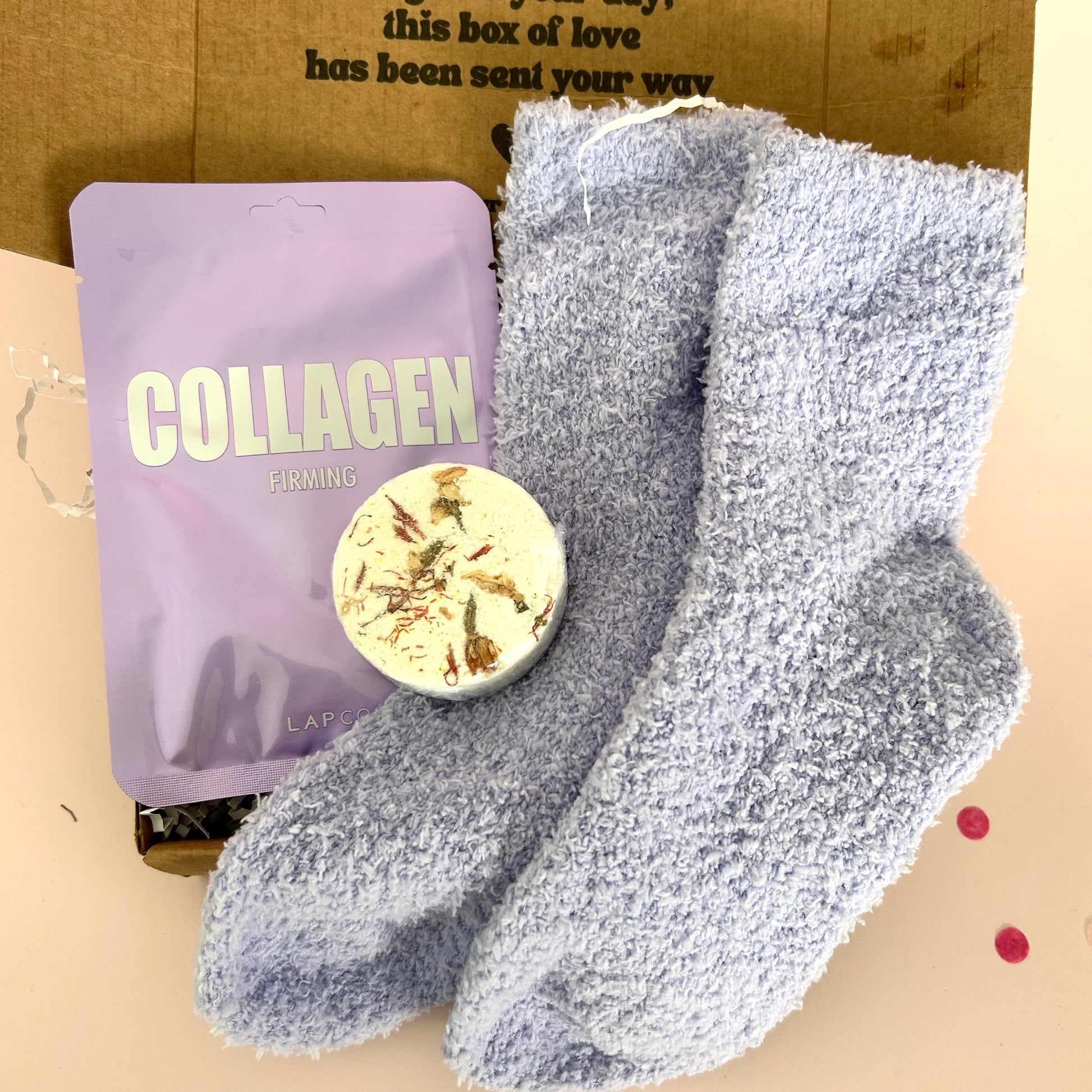 gift box with socks, face mask and shower steamer