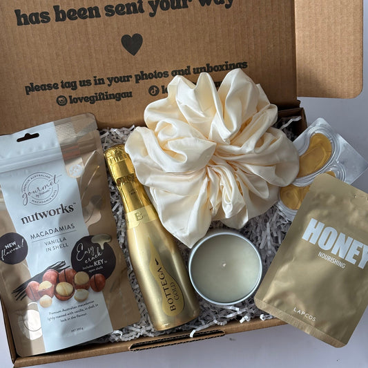 Gift box with a candle, honey face mask sheet, scrunchie, prosecco 