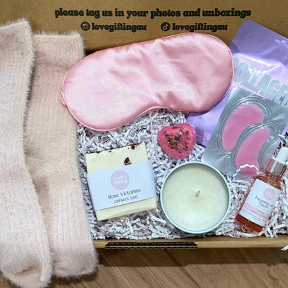 Pamper Box filled with luxury items , candle, socks, soap, face serum, facemask