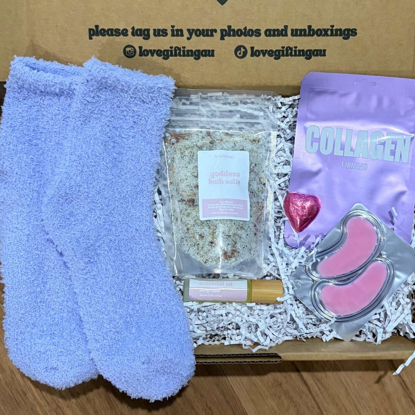 Pamper Gift Box including socks, a heart-chocolate, energy roller, bath salts.