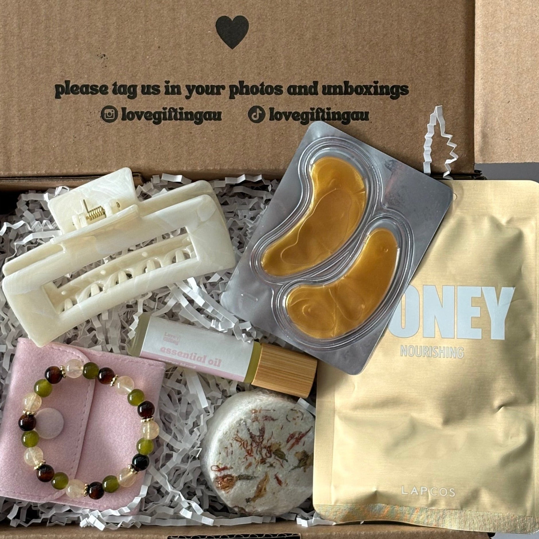 Menopause gift set including menopause bracelet, hair clip, energy roller, steamer, facemask sheet and under eye mask