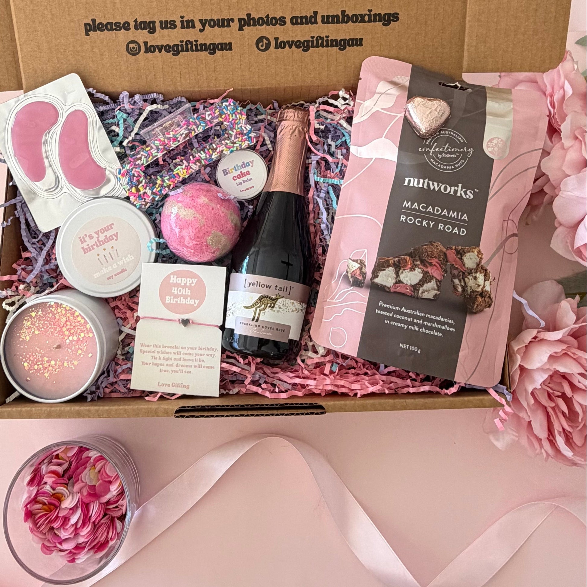 40th birthday gift box including prosecco, bath bomb, candle, braceklet, rocky road, hair clip and lipbalm