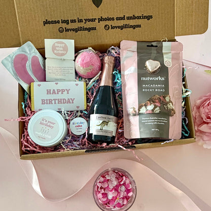 40th birthday gift box full of rocky road, prosecco, candle, bath bomb, 40th bracelet, under eye mask, and birthday cake lipbalm. Choice of sparkle claw clip or chocolate