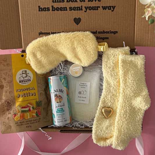 Tropical gift box includes cocktail, sleep mask, tropical lollies, mango scrub and socks , lipbalm