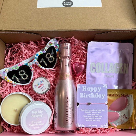 18th Gift box with birthday-themed items including a bottle, snacks, and decorative elements.