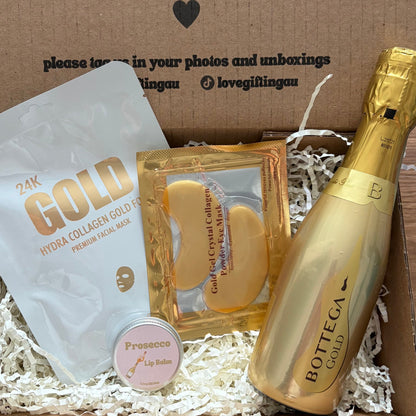Gift box with gold bottle, gold packaging, and white product inside, branded 'Bottica'.