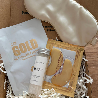 Sleep product set including a sleep mask, cream, and face masks in a box.