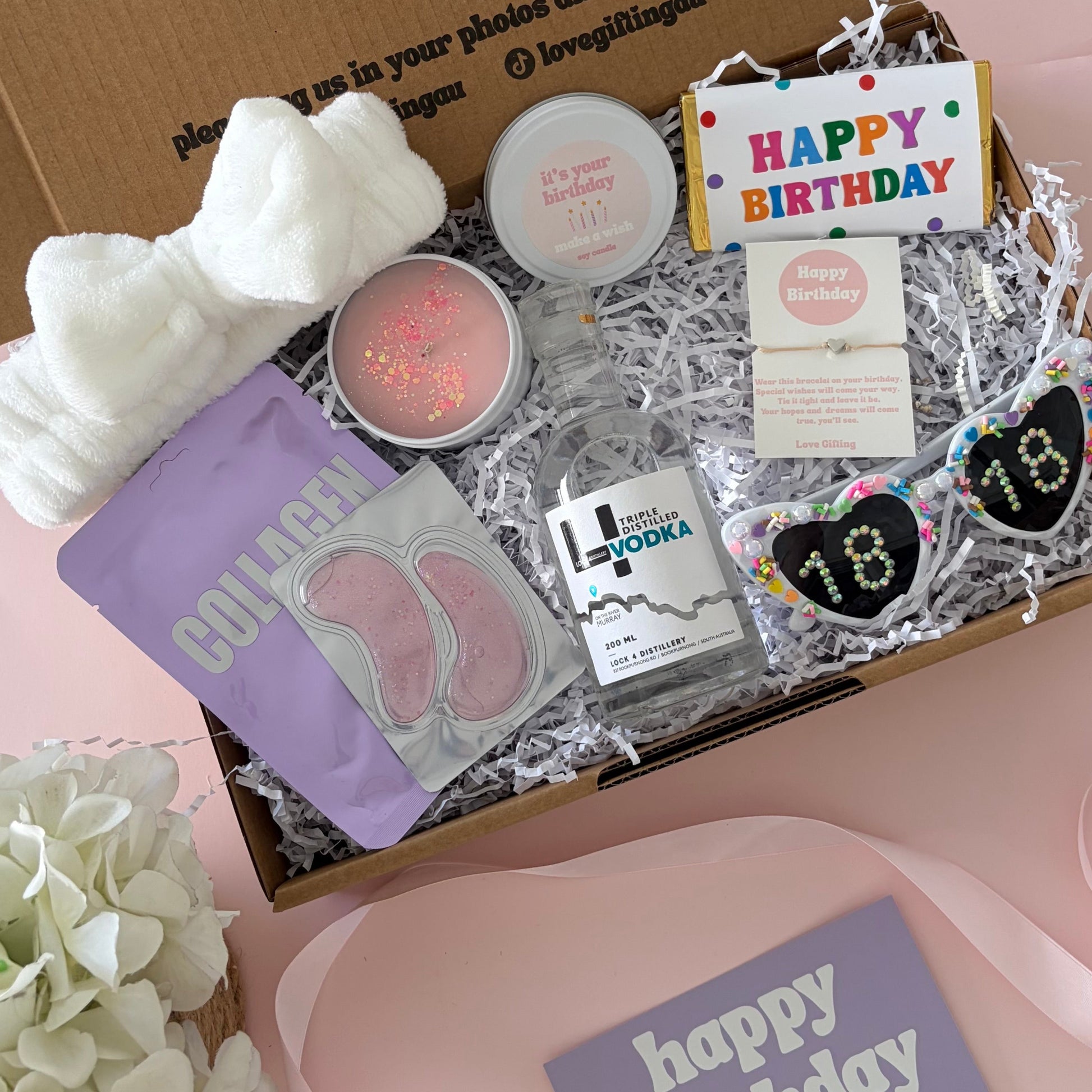 Vodka birthday box includes facemask, under eye, candle , 18th glasses , happy birthday chocolate and 18th birthday bracelet