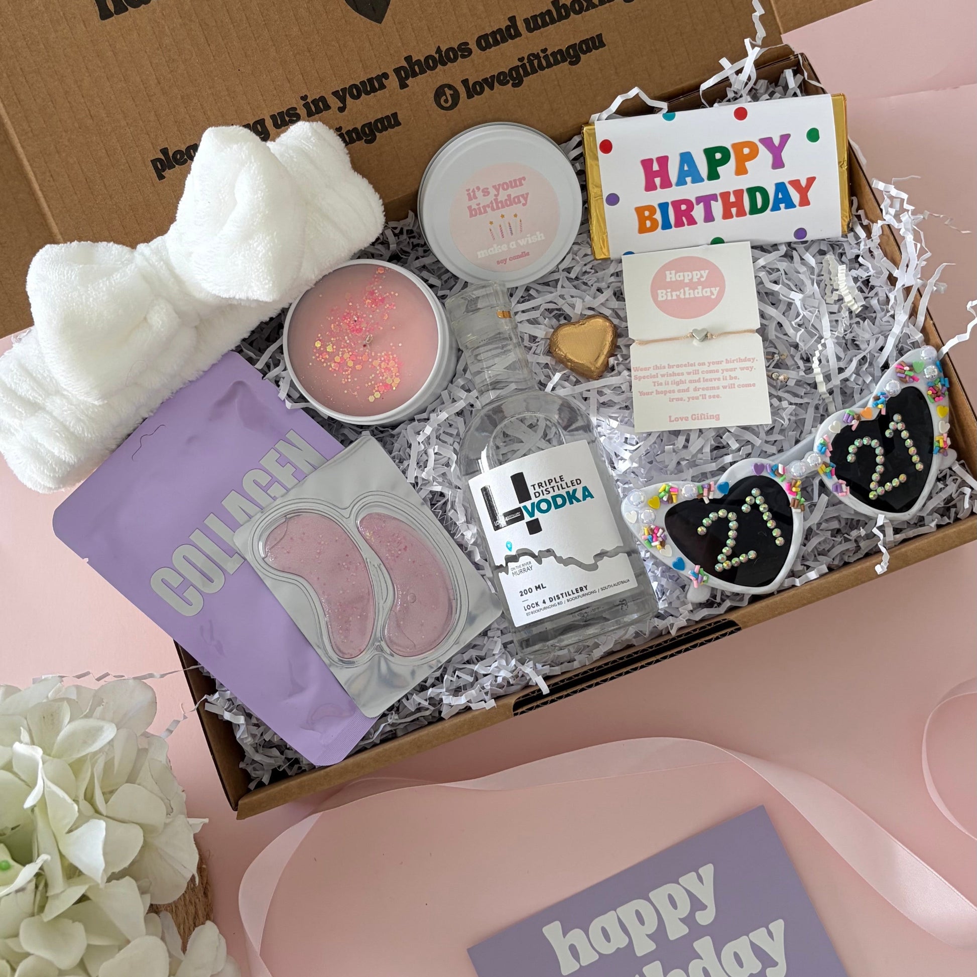 Vodka birthday box includes face mask, under eye, candle , glasses , happy birthday chocolate and 21st birthday bracelet