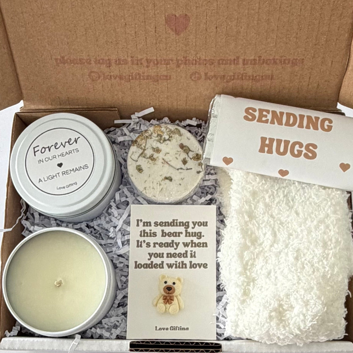 Sending a Gentle Hug sympathy gift box featuring Sending Love, Light & Comfort candle, shower steamer, cosy socks, chocolate and mini bear keepsake.
