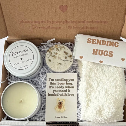 Sending a Gentle Hug sympathy gift box featuring Sending Love, Light & Comfort candle, shower steamer, cosy socks, chocolate and mini bear keepsake.