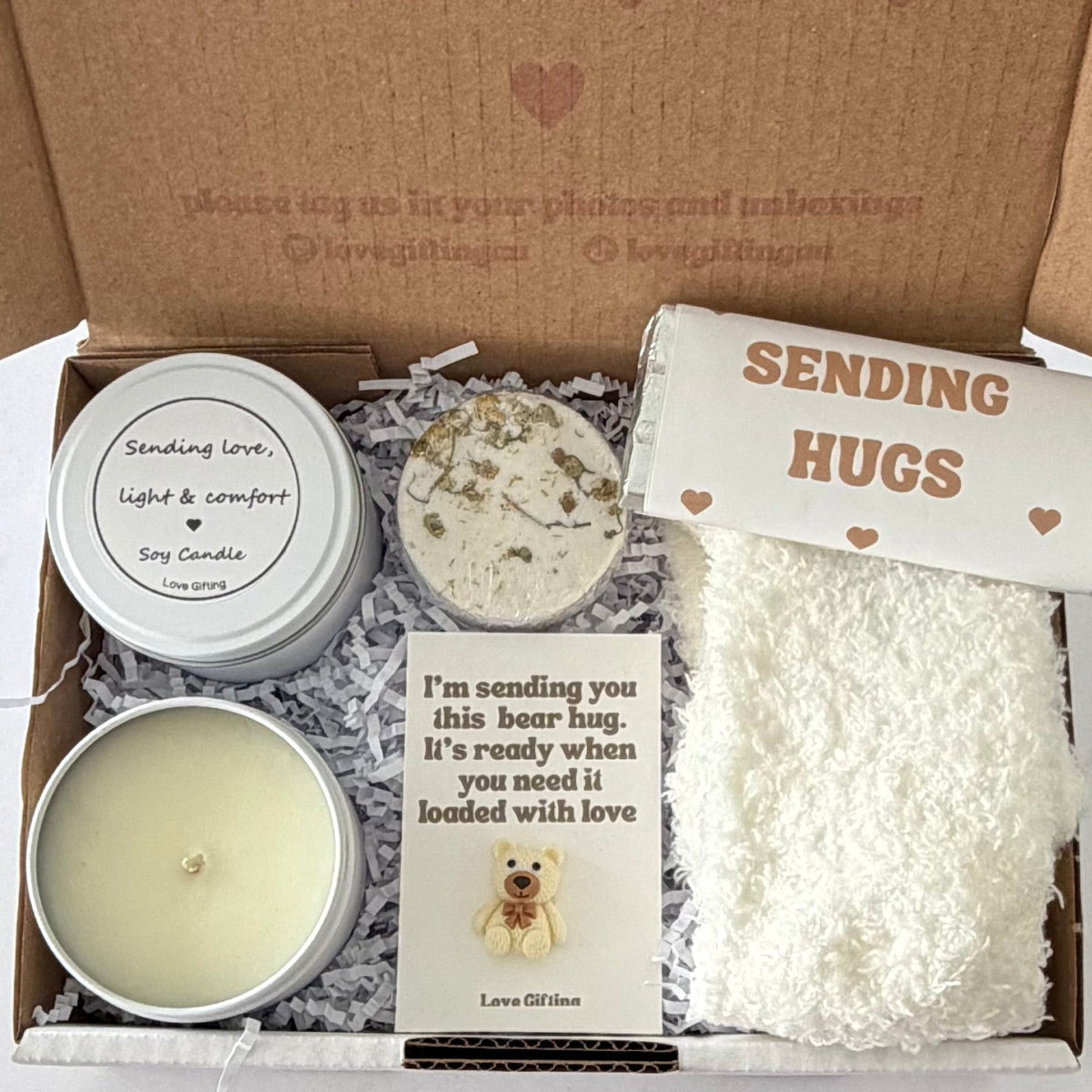 Sending a Gentle Hug sympathy gift box featuring Sending Love, Light & Comfort candle, shower steamer, cosy socks, chocolate and mini bear keepsake.