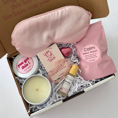 You've Got This Calm & Comfort Gift Box with pink satin sleep mask, rose quartz bracelet, soy candle, shower steamer and calming roll-on.
