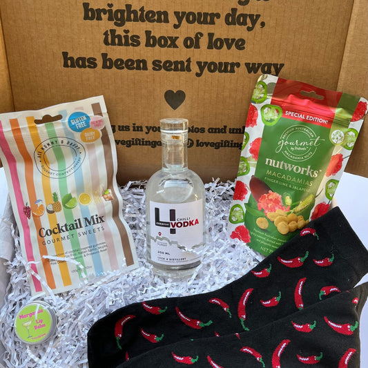 Gift box with cocktail mix lollies , chilli vodka, spicy macadamia nuts, and chili pepper socks and margarita Lip Balm.