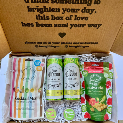 Gift box with Jose Cuervo margarita cans, cocktail mix, Jalapeno nutworks macadamia nuts and lip balms