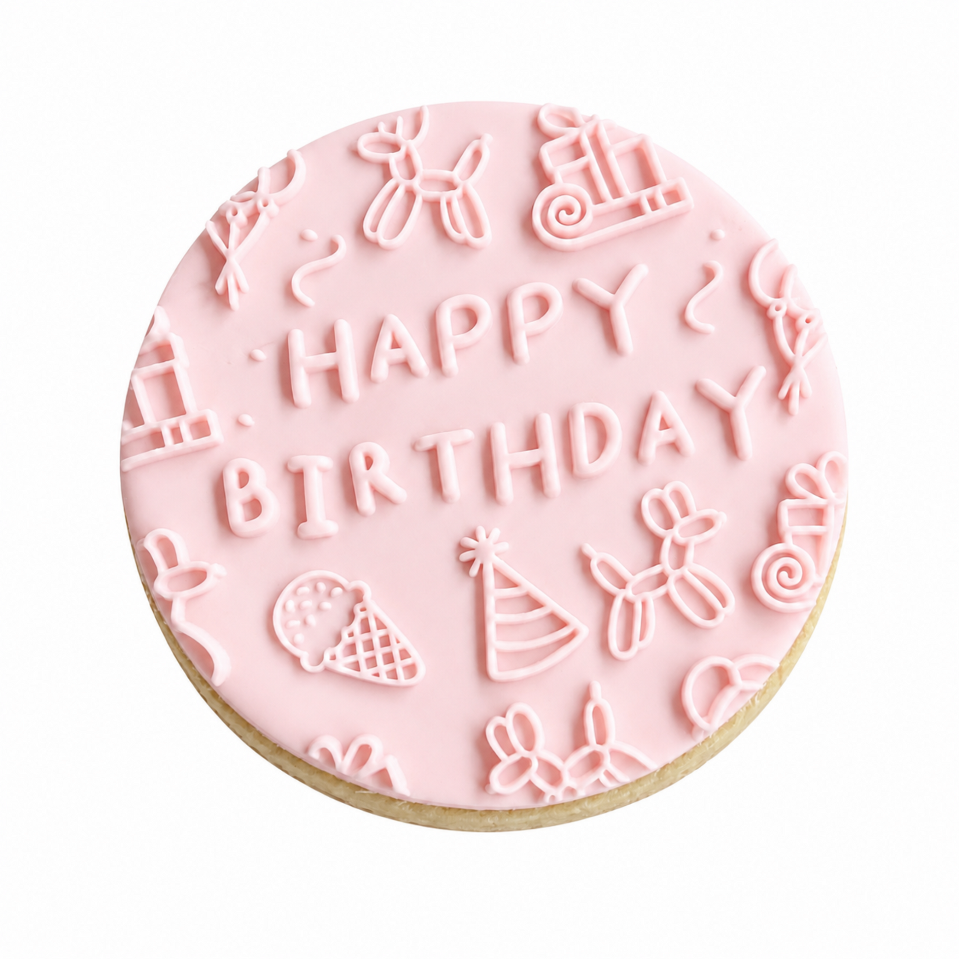 A round birthday cookie with light pink icing, featuring the words 'HAPPY BIRTHDAY' in raised letters surrounded by small festive illustrations like balloons, an ice cream cone, a party hat, and swirls, on a white background.