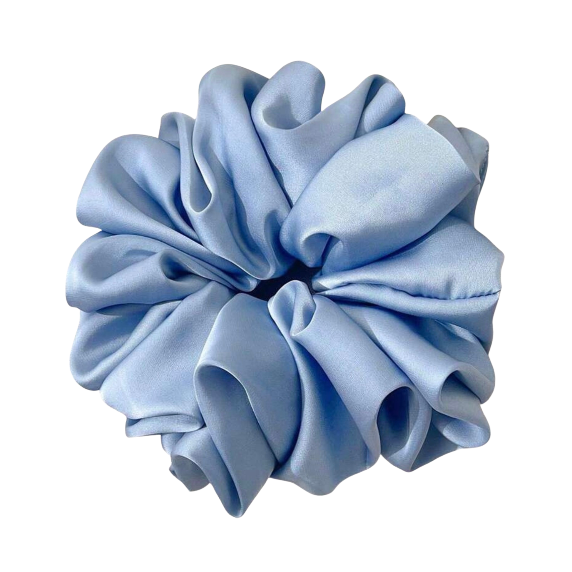 Gift box with self-care items including a sleep mask, bath bombs, and pouches on a wooden surface.