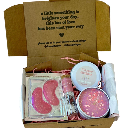 Gift box with pink collagen under eye patches, Bath Salt Soak and HAppy birthday candle