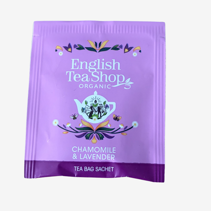 Purple tea bag sachet from English Tea Shop with floral design and text.