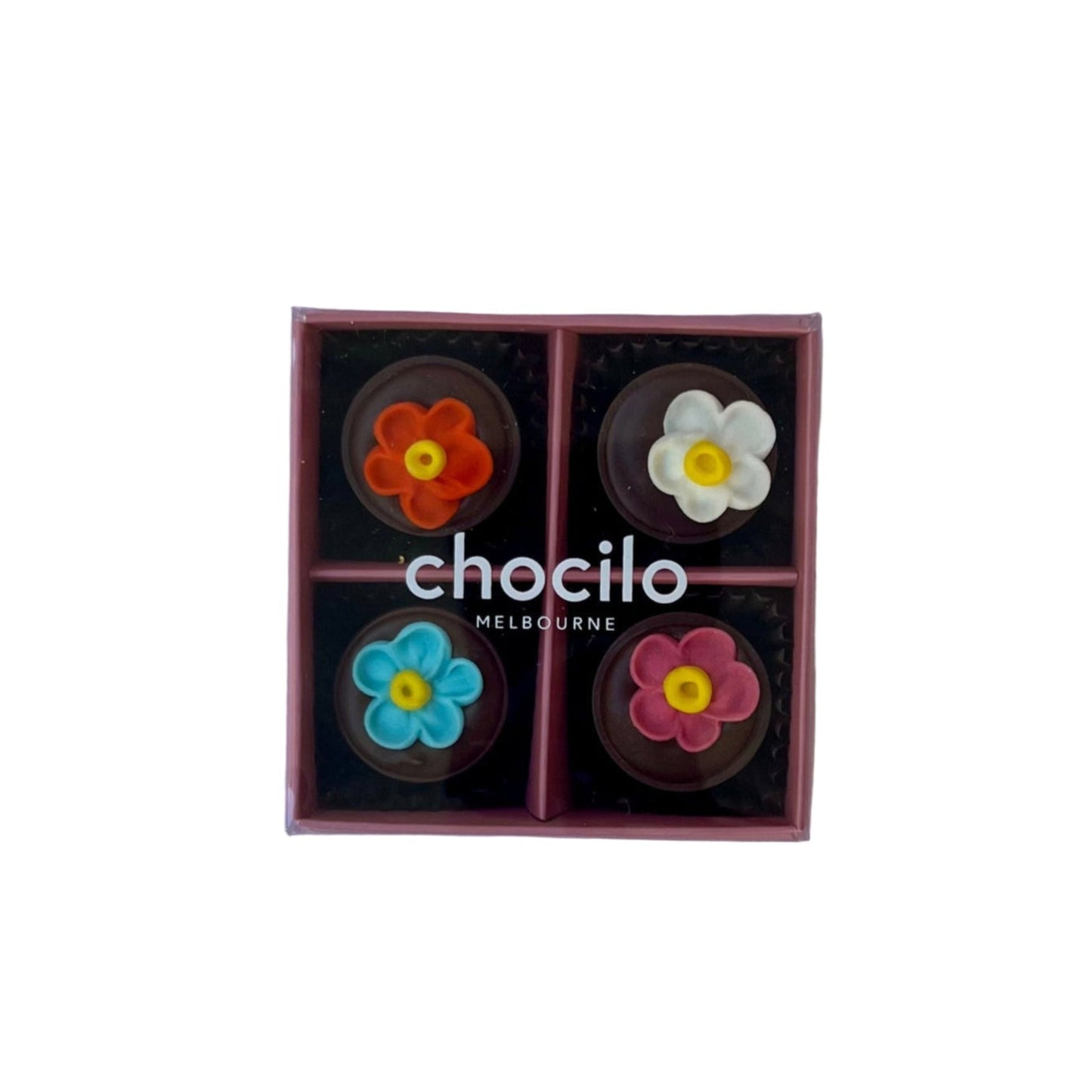 Box of chocolates with flower designs on a pink plate, branded 'chocilo'.