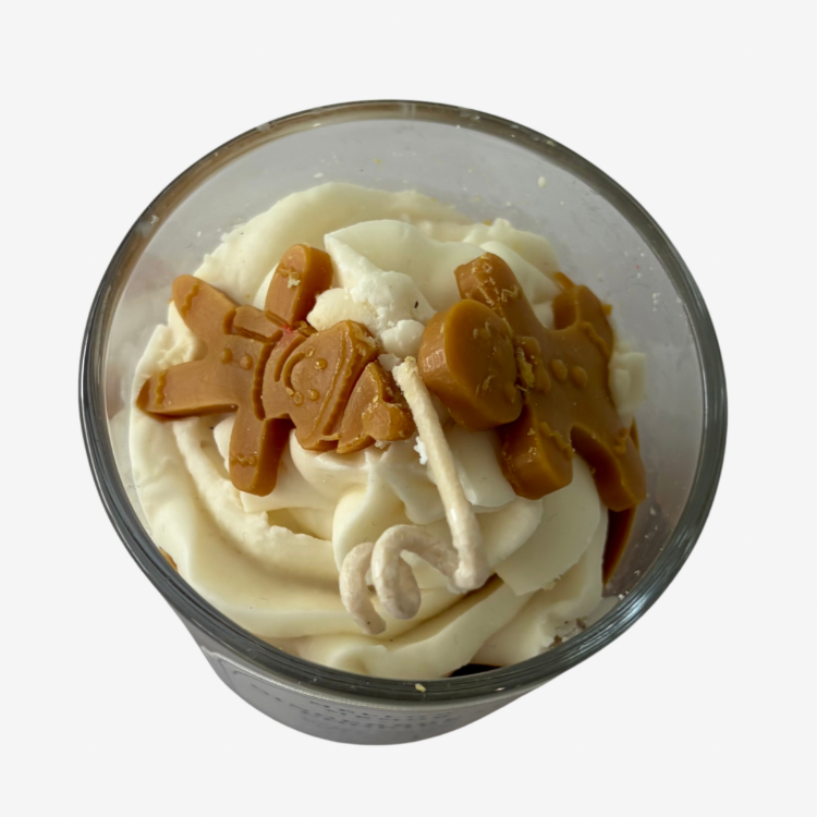 Gingerbread Cookies scented Christmas candle styled with festive gingerbread decorations and cinnamon sticks, featuring a 150g coconut soy wax candle.