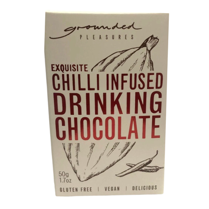A package of Grounded Pleasures Exquisite Chilli Infused Drinking Chocolate, featuring a cream-colored box with dark red and black text and illustrations of chili peppers.
