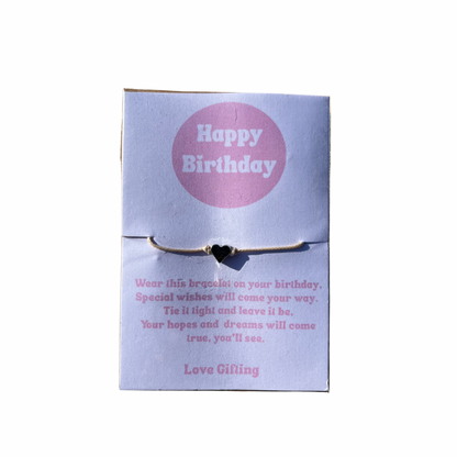 Bracelet on a 'Happy Birthday' card with text