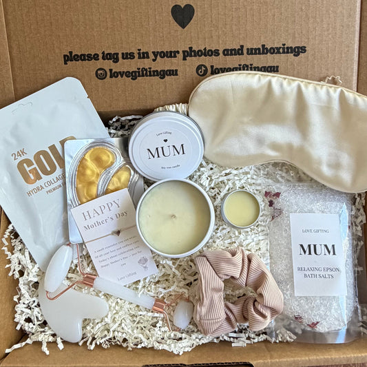 Gift box with 'a little something to brighten your day' message on a wooden surface