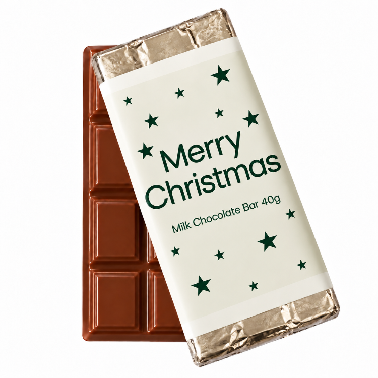 Merry Christmas 40g milk chocolate bar with cream wrapper, festive green stars and dark green lettering, a sweet Christmas gift box treat from Love Gifting.