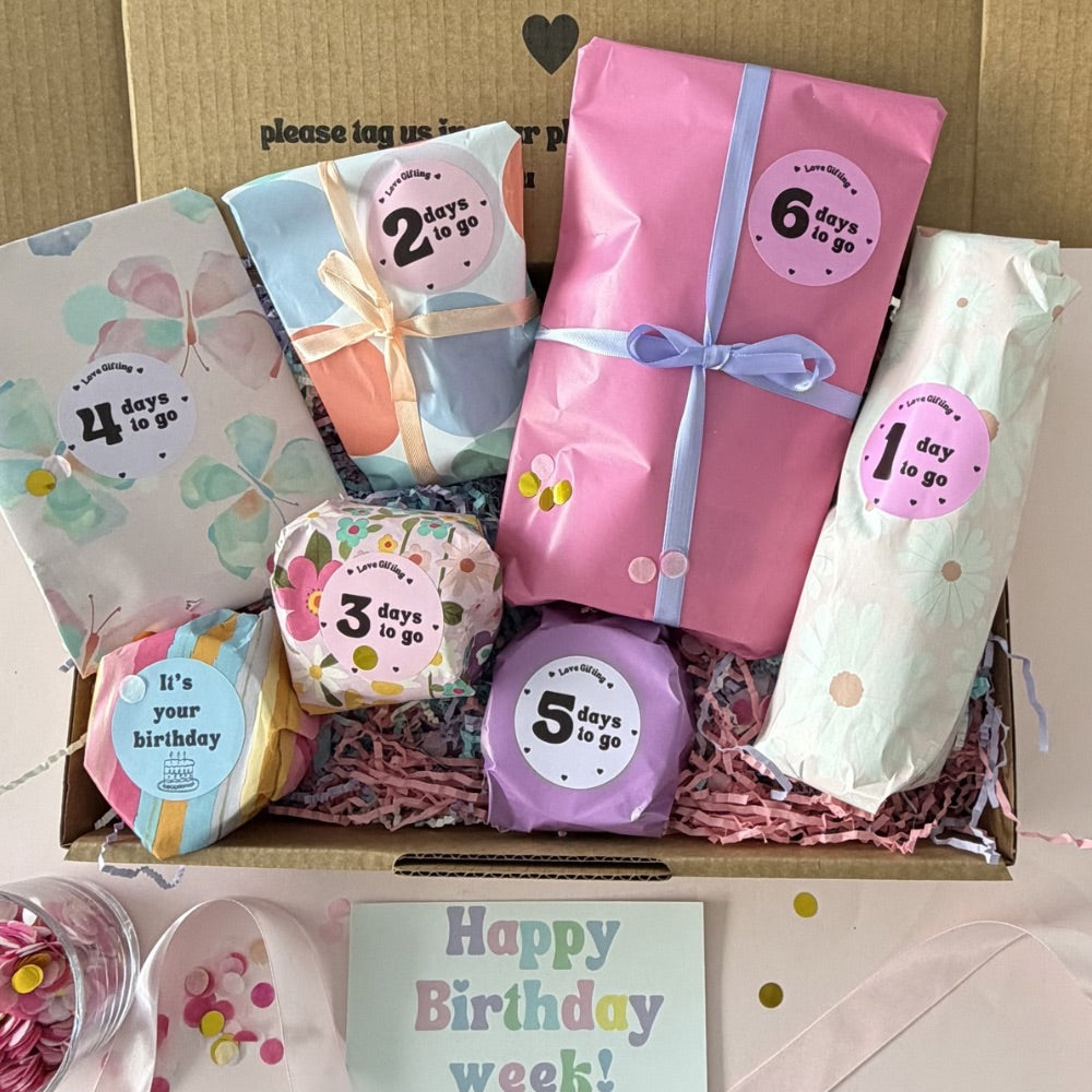 7 Day Birthday Advent Gift Box with wrapped birthday surprises and Happy Birthday Week card
