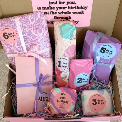 Box of birthday-themed soap bars with countdown labels, arranged in a decorative manner.
