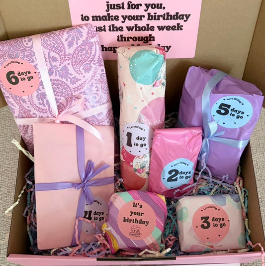 Box of birthday-themed soap bars with countdown labels, arranged in a decorative manner.