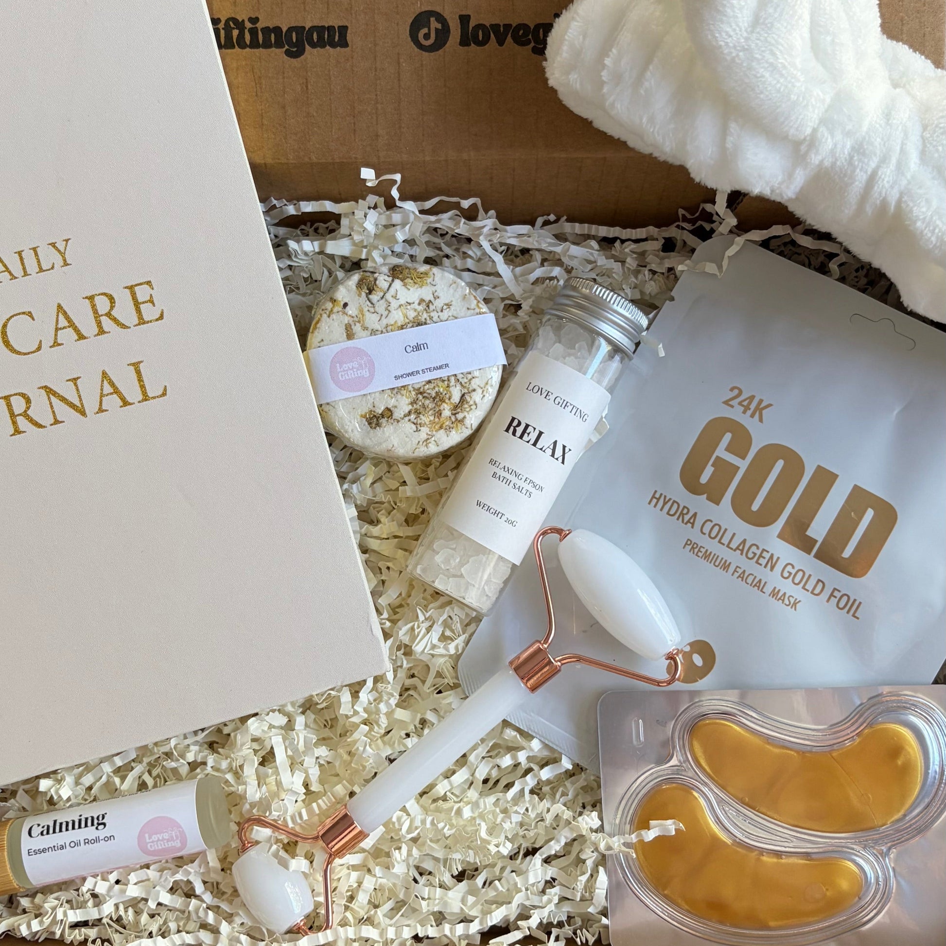 Unboxing of a beauty product set with a 'Gold' product and other items in a box.