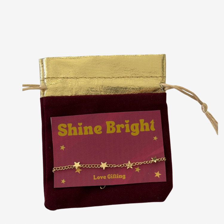 Gold-tone star bracelet with velvet gift bag for Christmas jewellery gift