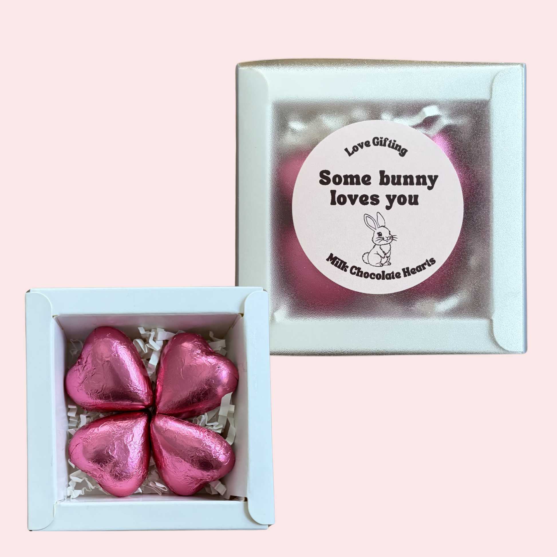 Pink chocolate hearts in a box with a 'Love Gifting' label on a pink background