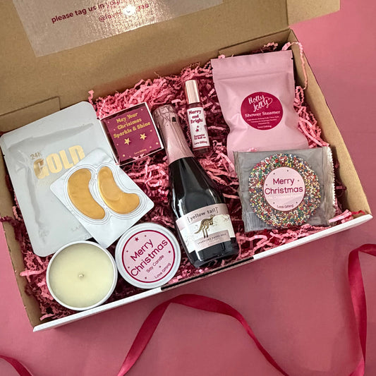 Festive Pamper & Treats Christmas Gift Box with sparkling rosé, chocolate, skincare masks, candle and festive gifts