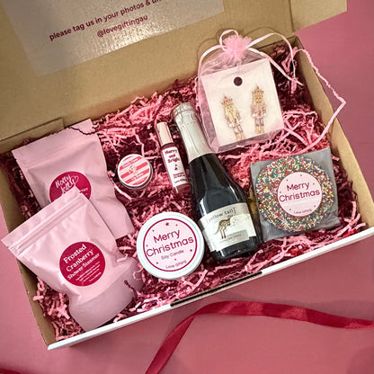 Merry Moments Christmas pamper gift box featuring festive jewellery, shower steamers and Christmas treats