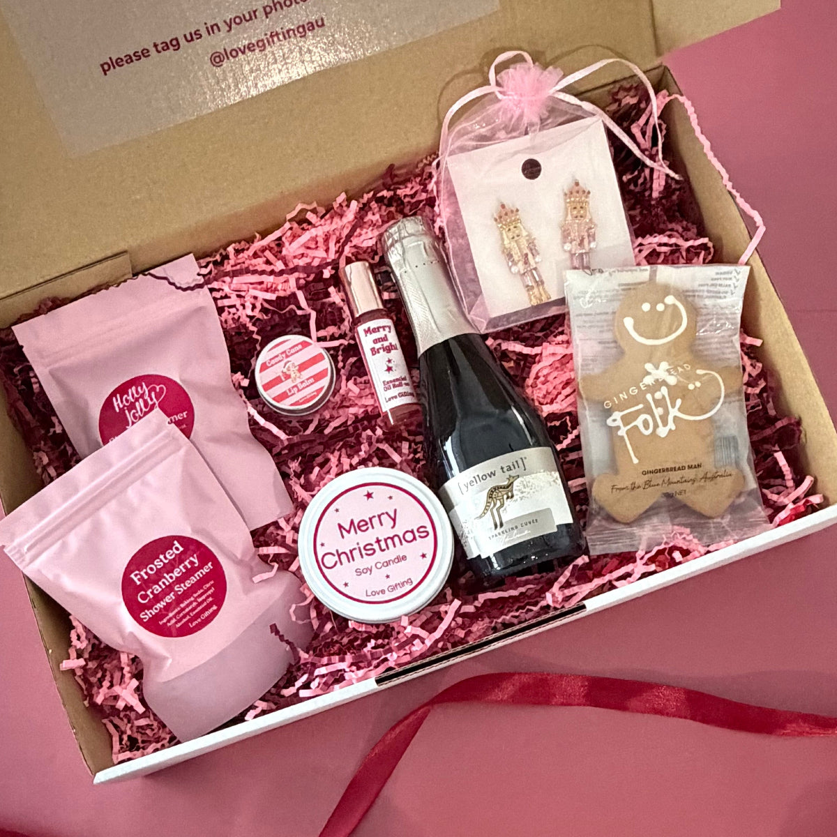 Merry Moments Christmas gift box with pink nutcracker earrings, festive candle, peppermint lip balm and pamper treats