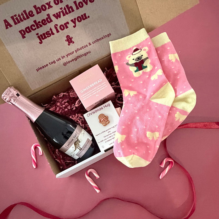 Send a little Christmas cheer with sparkling rosé, Chocilo gingerbread chocolates, festive socks and a Christmas Pocket Hug. Shop Love Gifting.