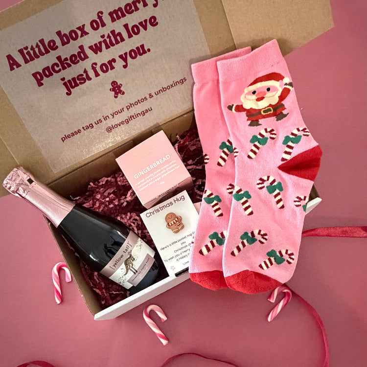 Send a little Christmas cheer with sparkling rosé, Chocilo gingerbread chocolates, festive socks and a Christmas Pocket Hug. Shop Love Gifting.