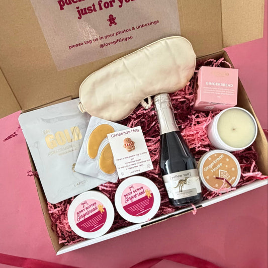 Gingerbread Bubbles and Pamper Christmas Gift Box with sparkling wine, gingerbread chocolates, candle and gold pamper products