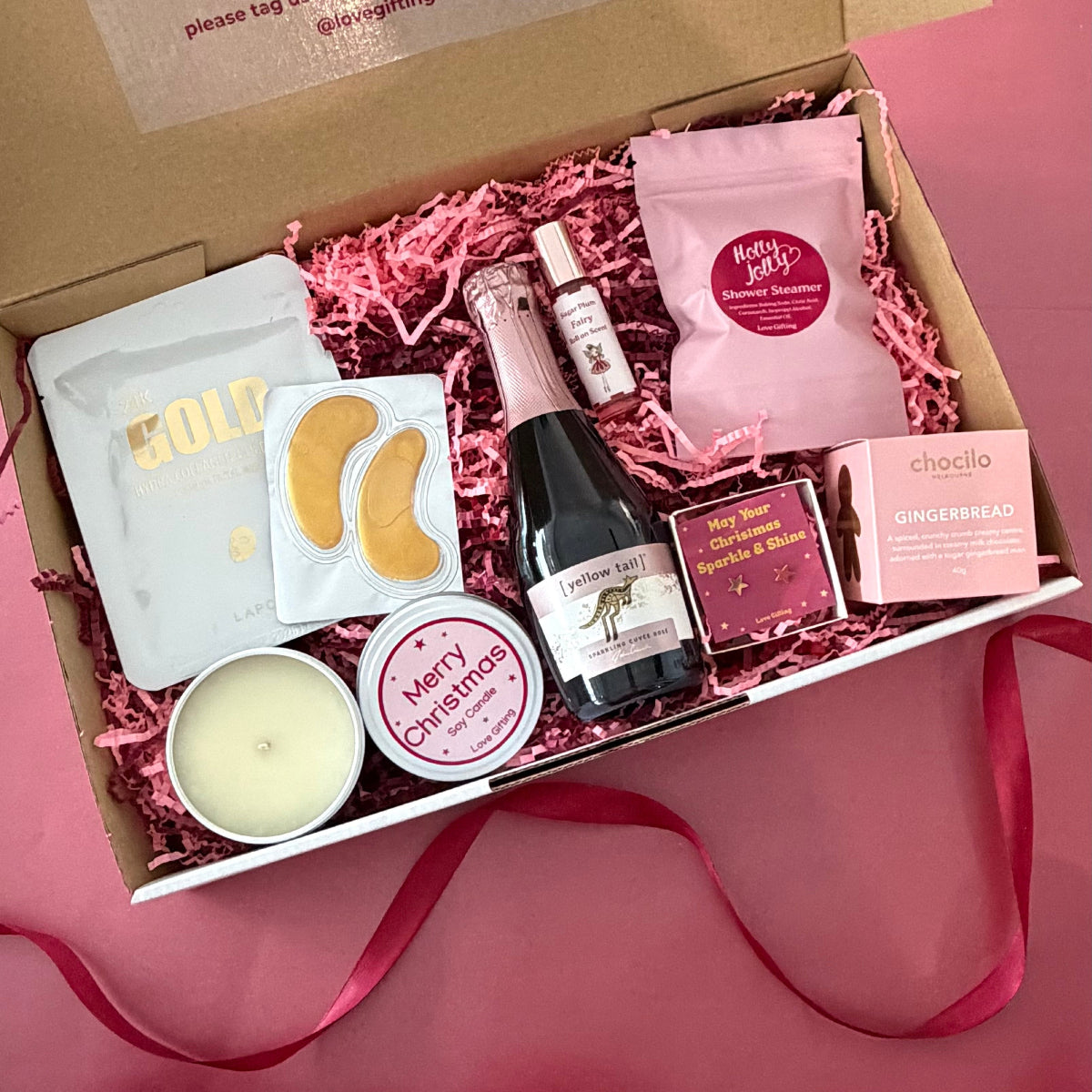 Sip, Sparkle & Gingerbread Christmas Gift Box with sparkling rosé, gingerbread chocolates, candle, jewellery and pamper gifts